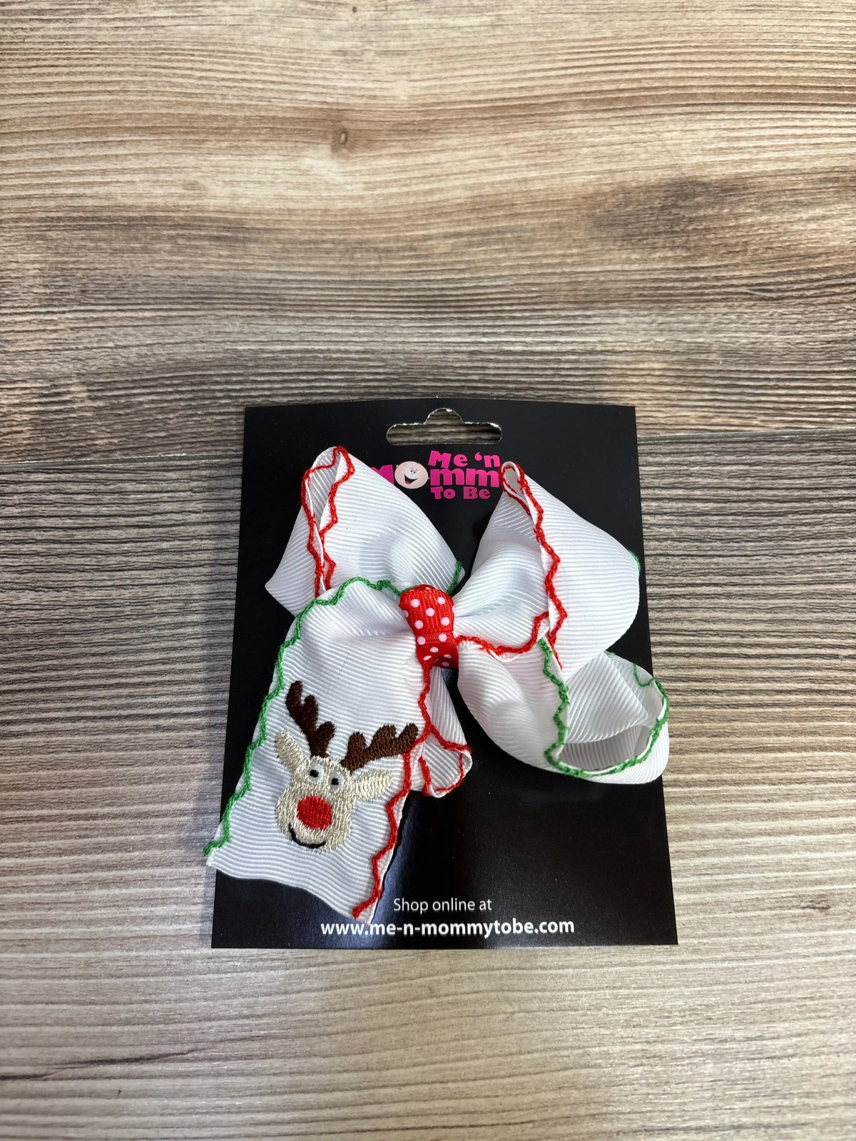 White Christmas reindeer hair bow with red and green trim, perfect for kids' holiday outfits