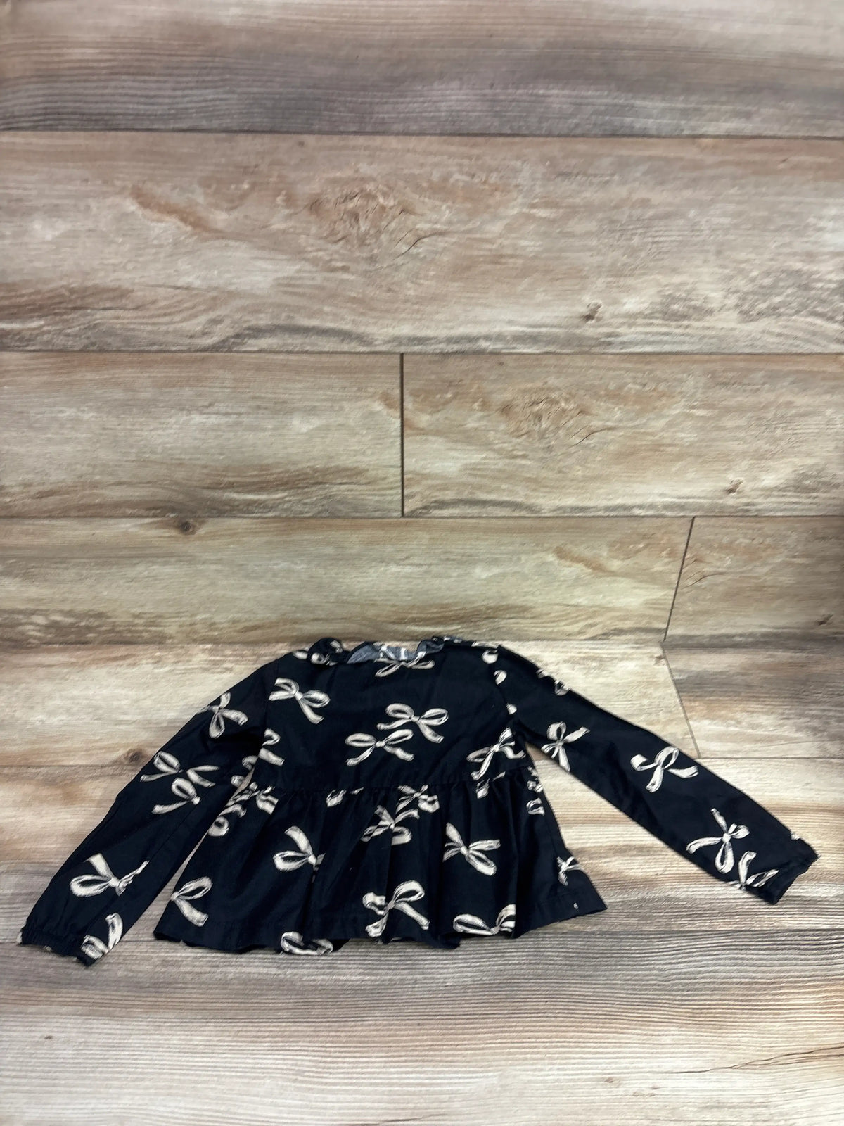 Carter's black long sleeve button-front shirt for toddlers with white bow print