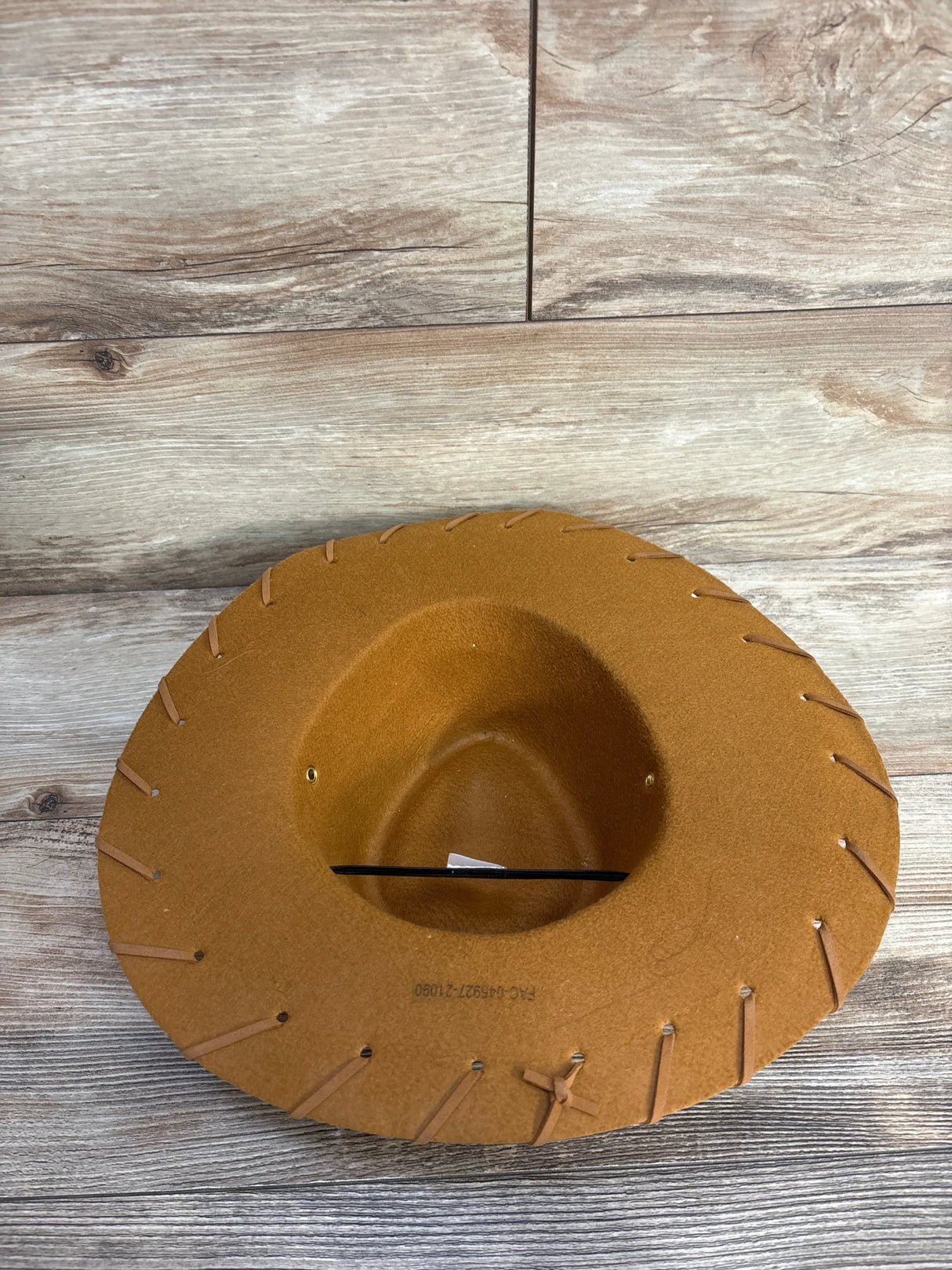 Brown felt cowboy hat with stitched brim, ideal for kids' western-themed outfits or costumes.