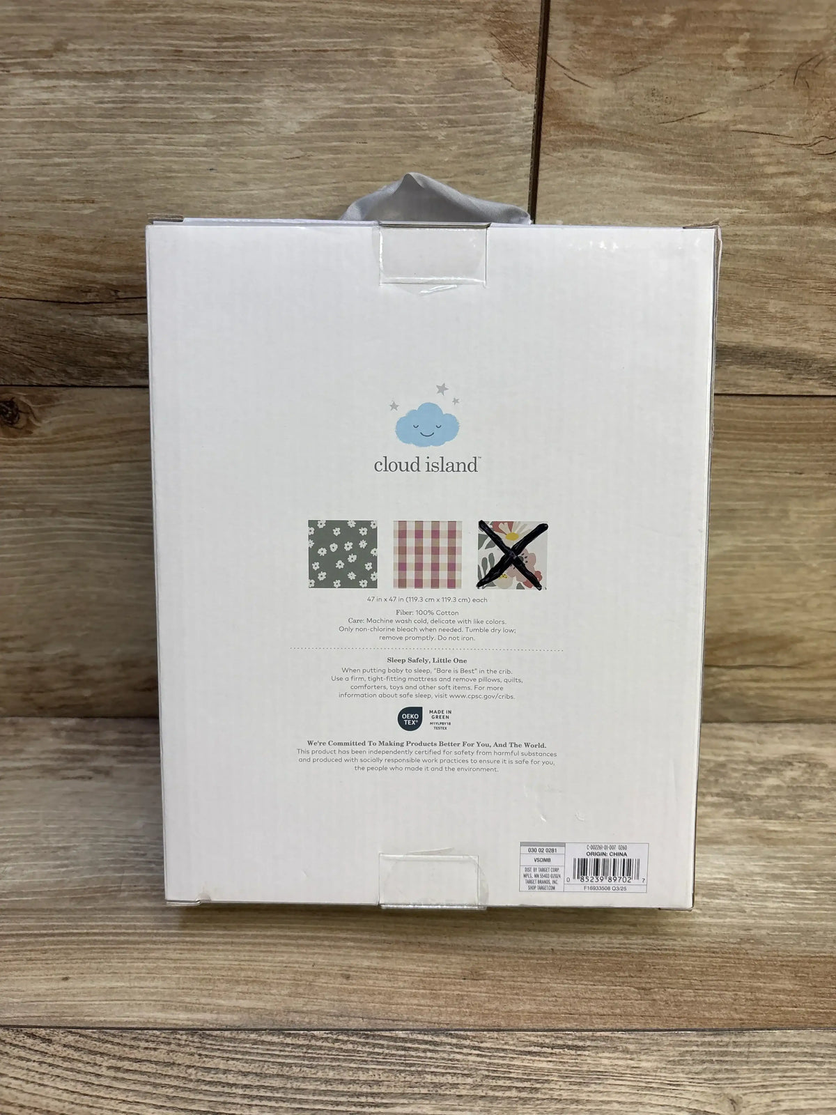 Back view of Cloud Island 2pk muslin swaddle blankets showcasing floral gingham and 47 by 47 inch size on wood flooring