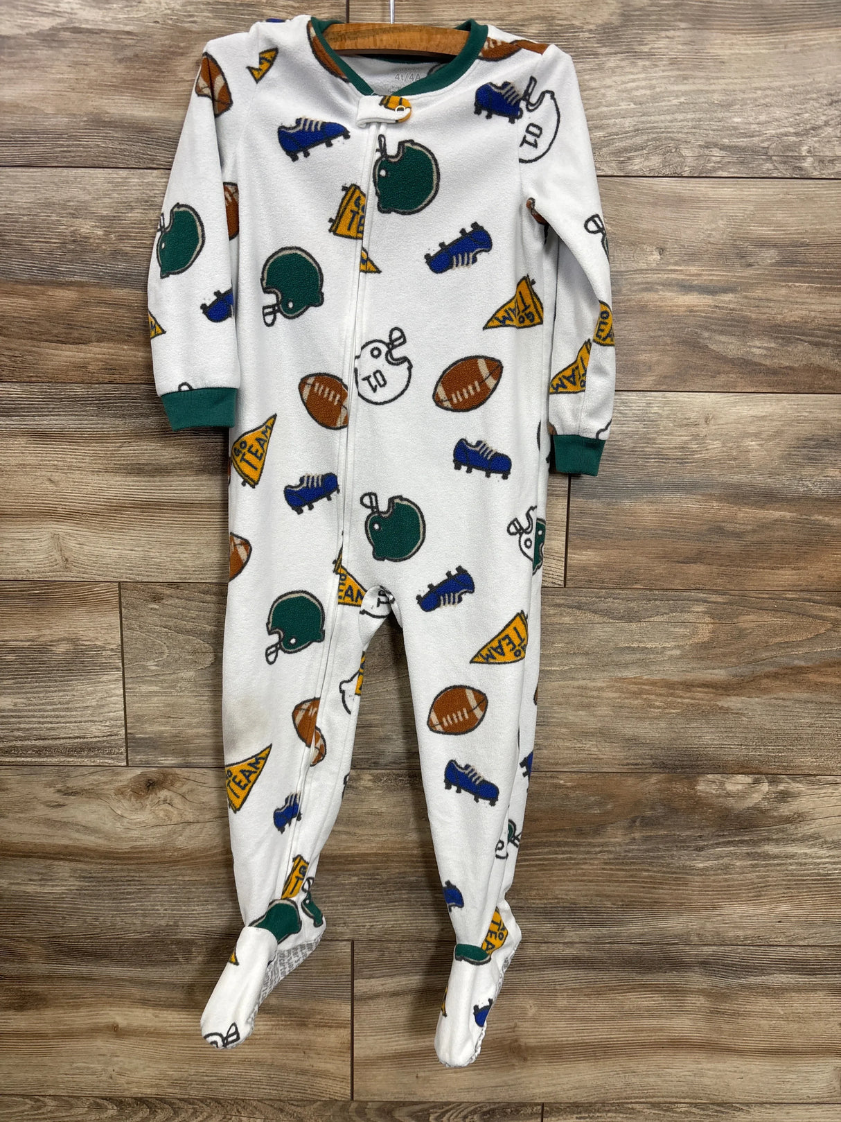 White footed baby sleeper with football, helmet, and sports pattern, zipper front