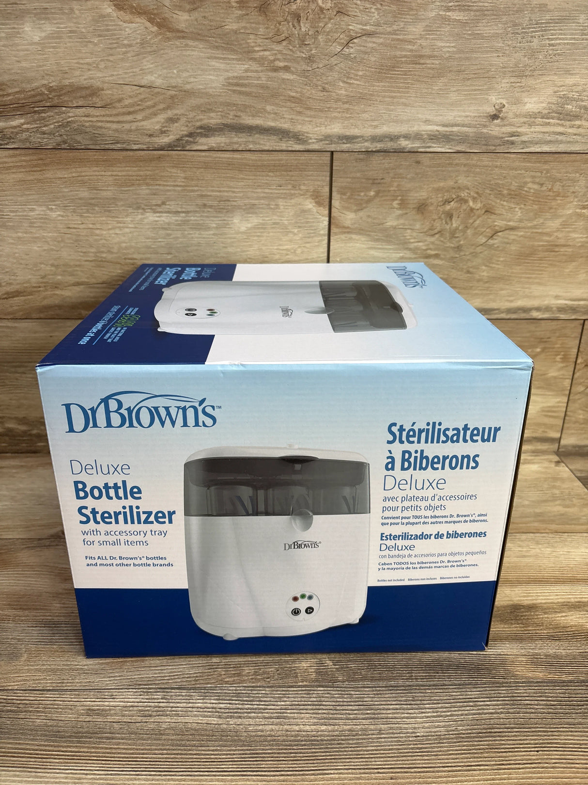 Dr. Brown's Deluxe Bottle Sterilizer box on wood background, baby bottle sterilizer product