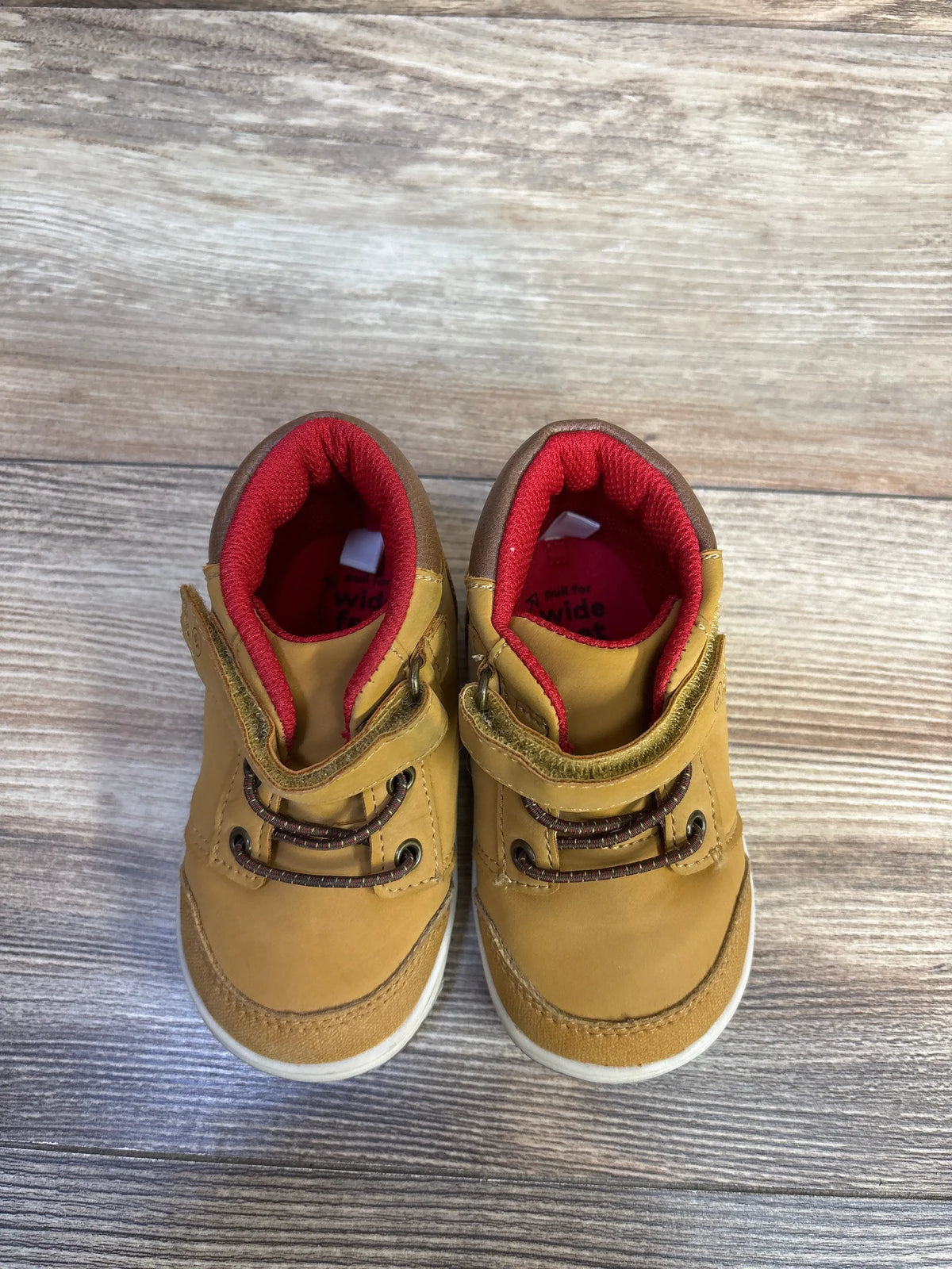 Top view of Stride Rite 360 sneaker boots, size 6C, showcasing honey yellow uppers, red lining, and hook-and-loop closures