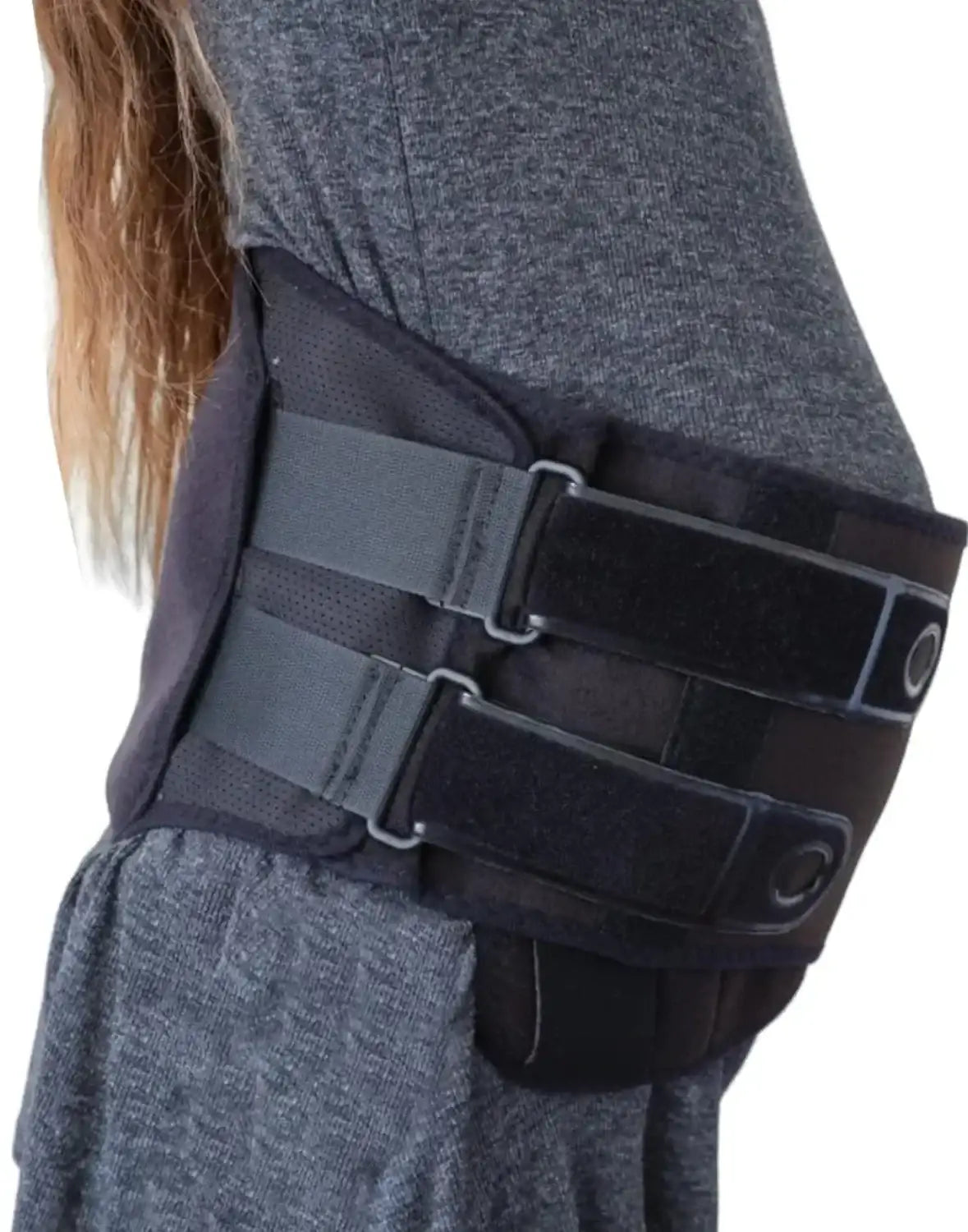 Side view of black Matriarch maternity support belt with double adjustable Velcro straps on model in gray dress