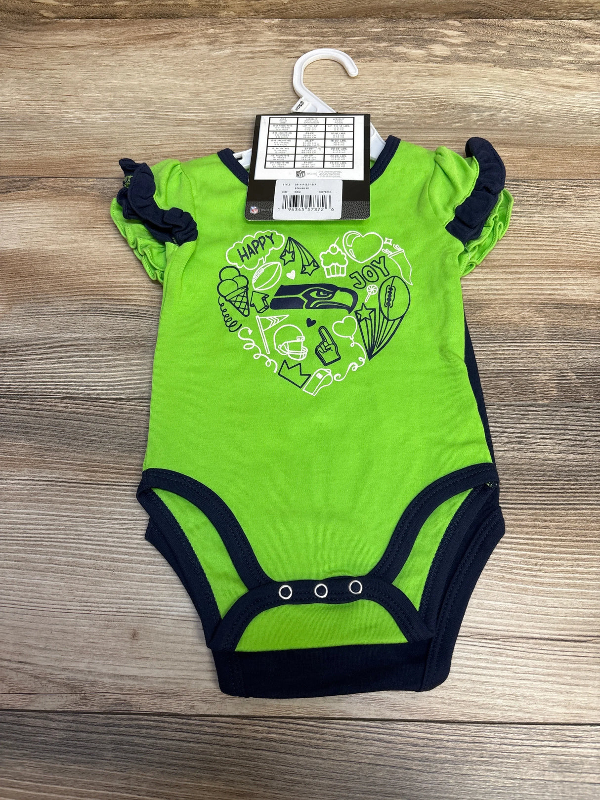 Green and navy baby onesie with Seattle Seahawks logo and football-themed heart design