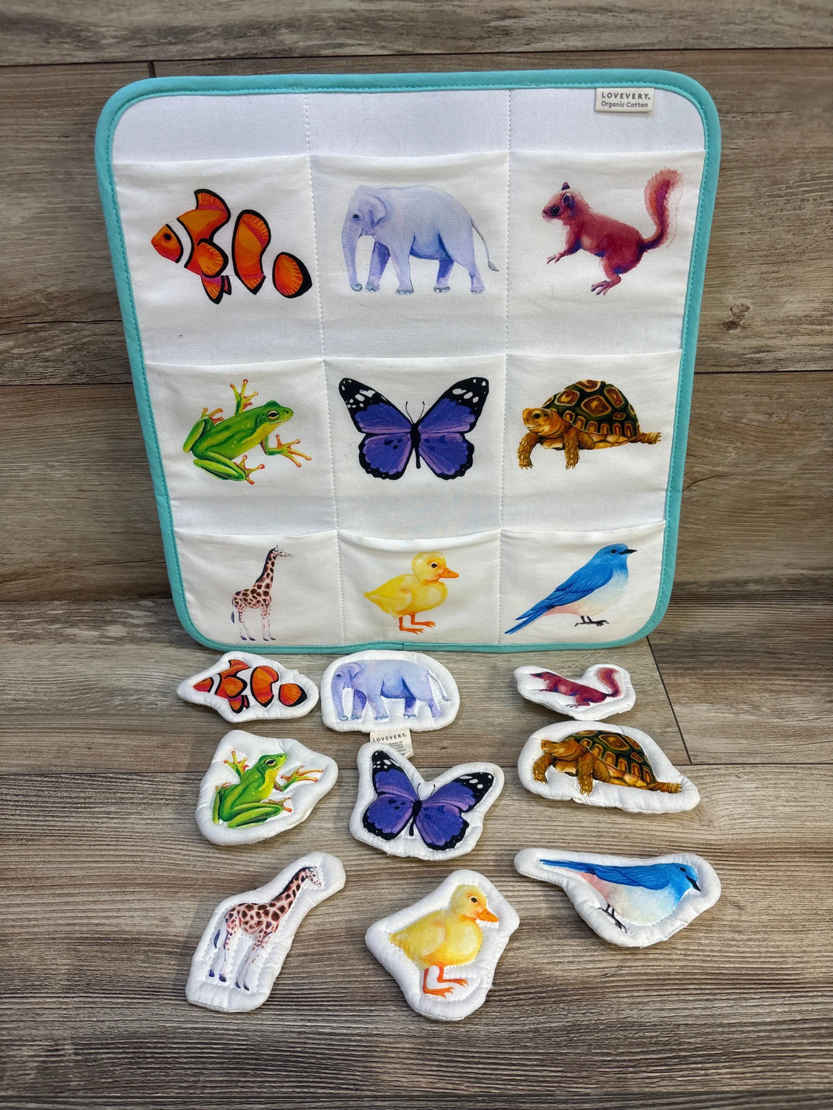 Lovevery organic cotton animal matching game for toddlers with fish, elephant, butterfly, frog, turtle, giraffe, duck, bird, and squirrel pieces