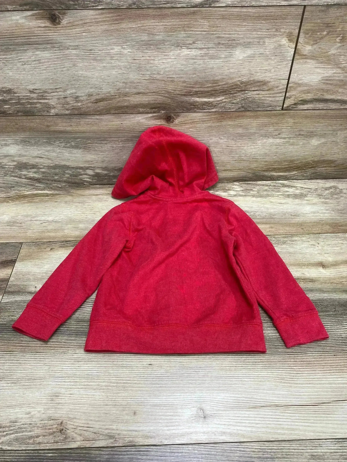 Back view of Oshkosh Logo Full Zip Hoodie Red sz 3T showcasing the hood and ribbed cuffs on a wood plank background