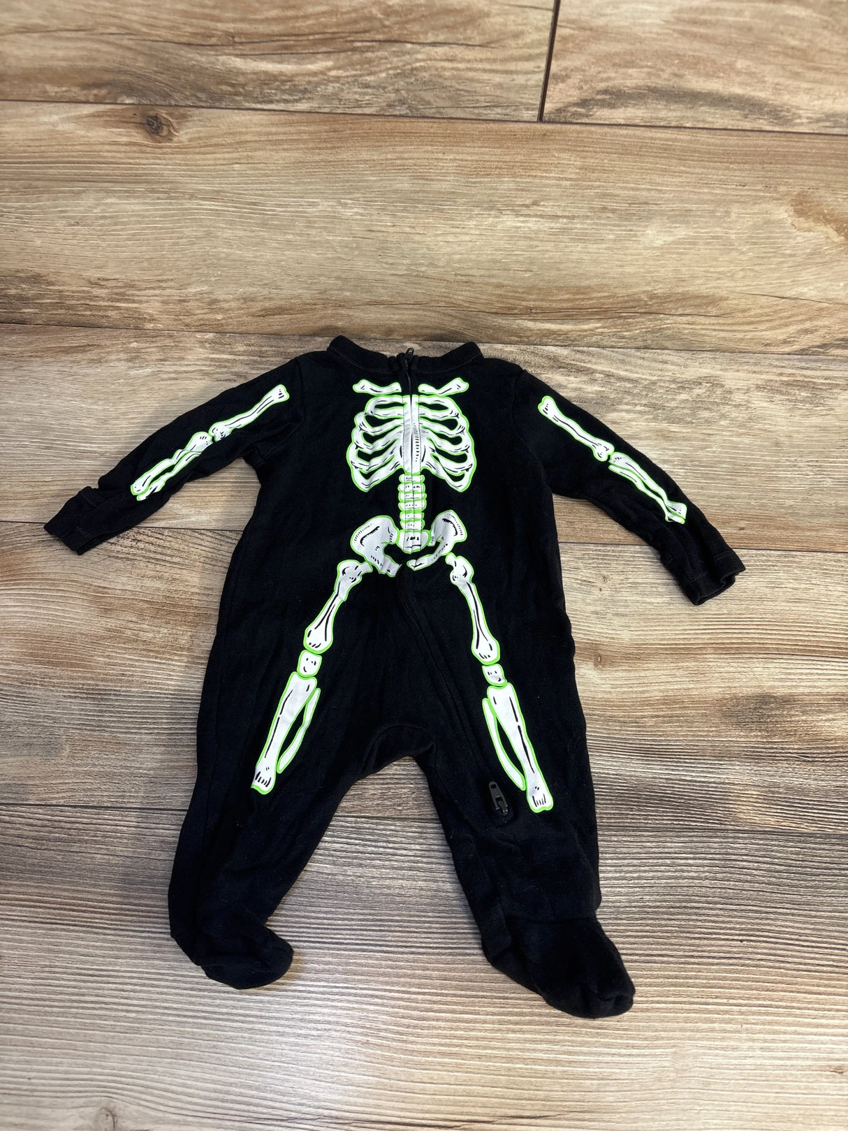Black baby skeleton costume with glow-in-the-dark bones, perfect for Halloween or dress-up play.
