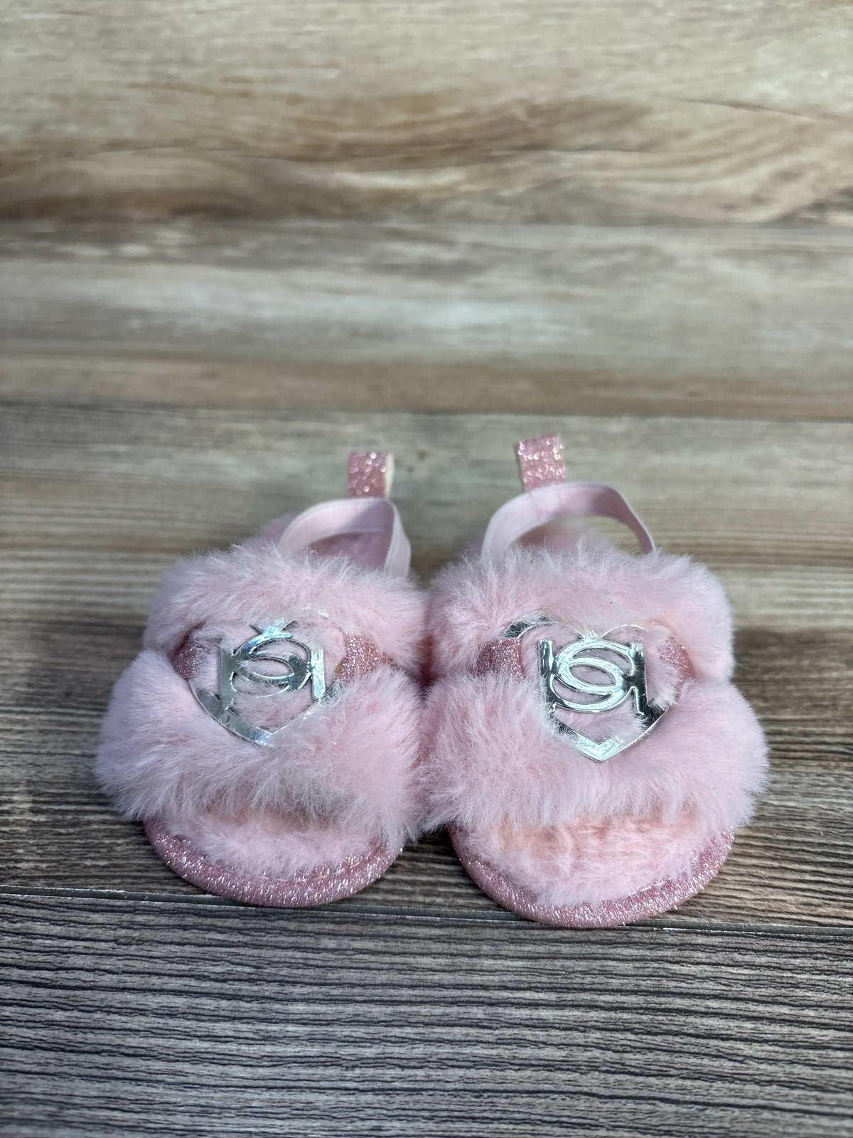Pink faux fur slide sandals for toddlers with silver heart detailing