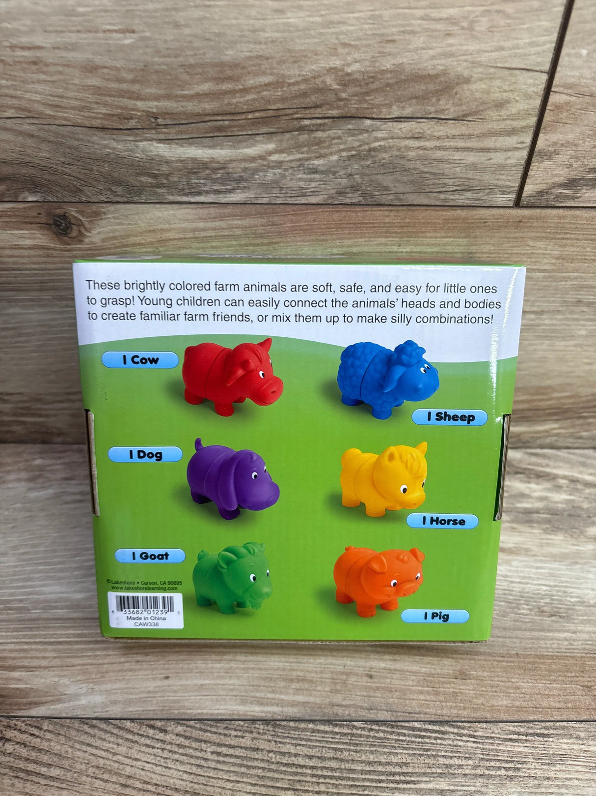 Back of Lakeshore magnetic farm animals box showing colorful magnetic figures on green background labeled with animal names