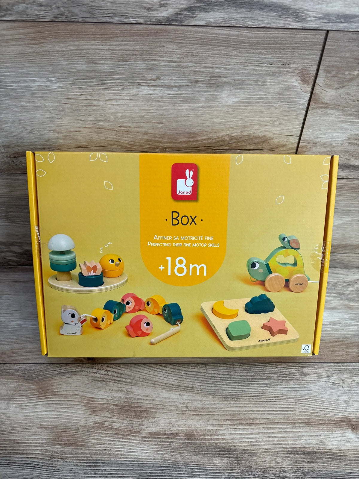 Janod wooden toddler toy set for fine motor skills, suitable for 18 months and up, boxed.
