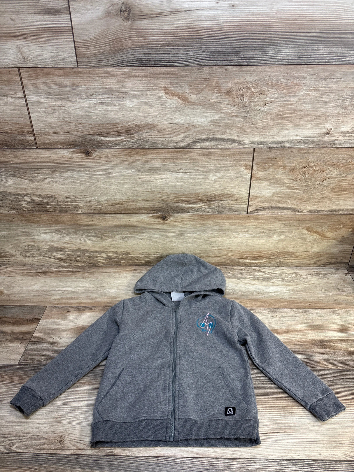 Gray kids' zip-up hoodie with lightning bolt patch on wood background, gently used clothing