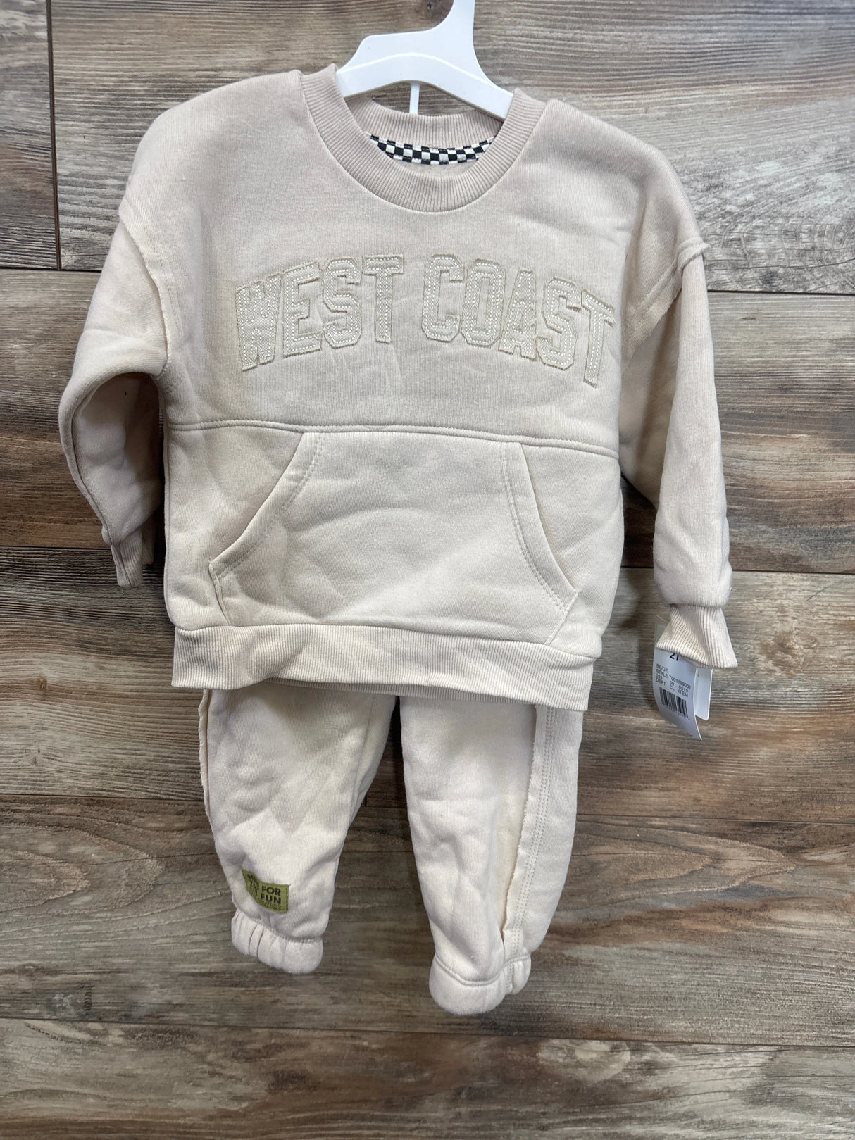 Beige kids 'West Coast' sweatshirt and footed pants set, cozy toddler outfit for playtime