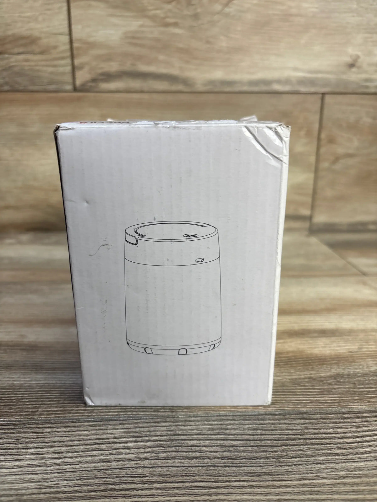 Front view of NEW One Fire Portable Night Light box showing the portable light illustration on a wood surface