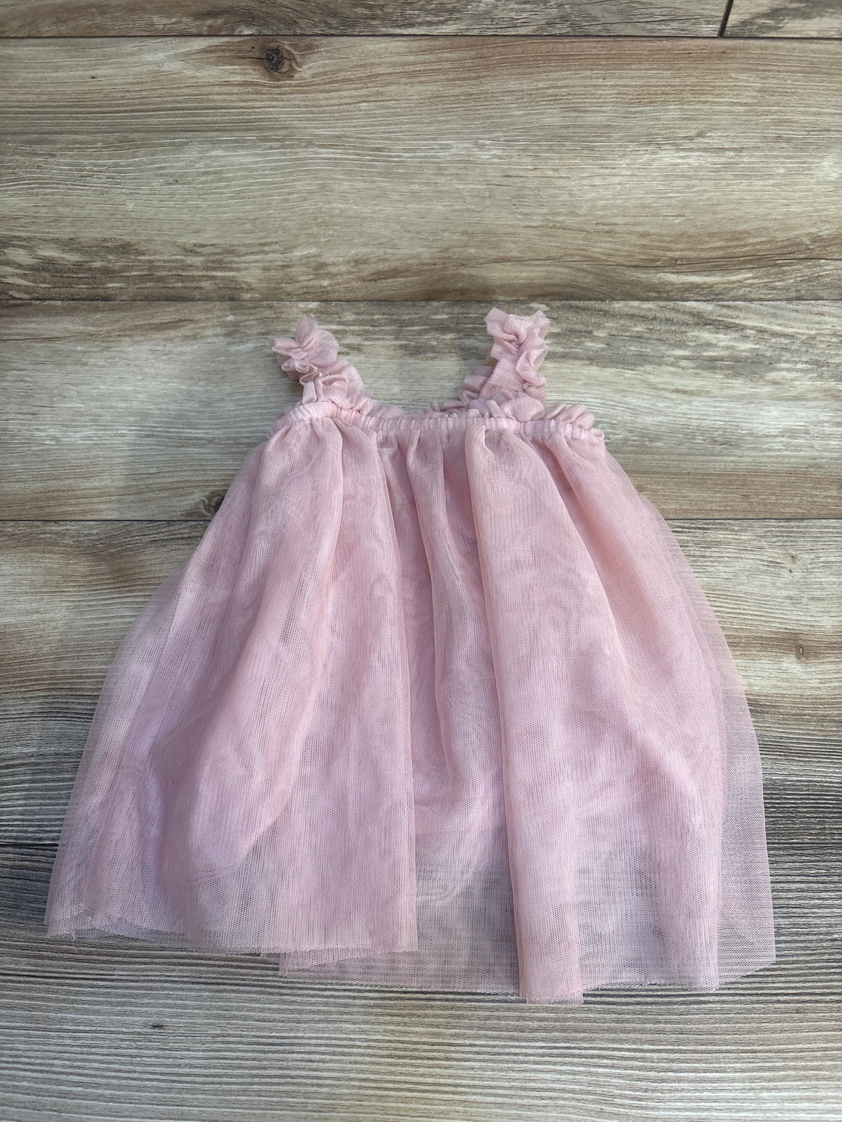 Pink tulle baby dress with ruffled straps, perfect for kids' special occasions and resale clothing.