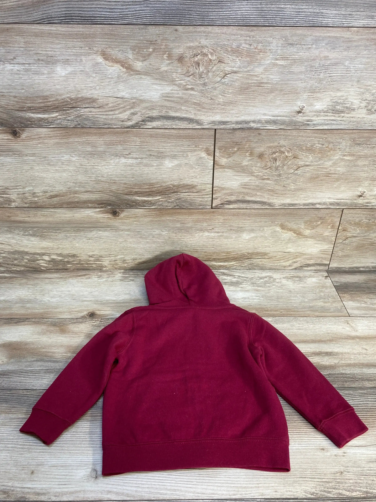 Back view of NEW Stadium Athletics Full Zip Florida State Jacket in burgundy, size 2T, showcasing hood and ribbed cuffs on wood background