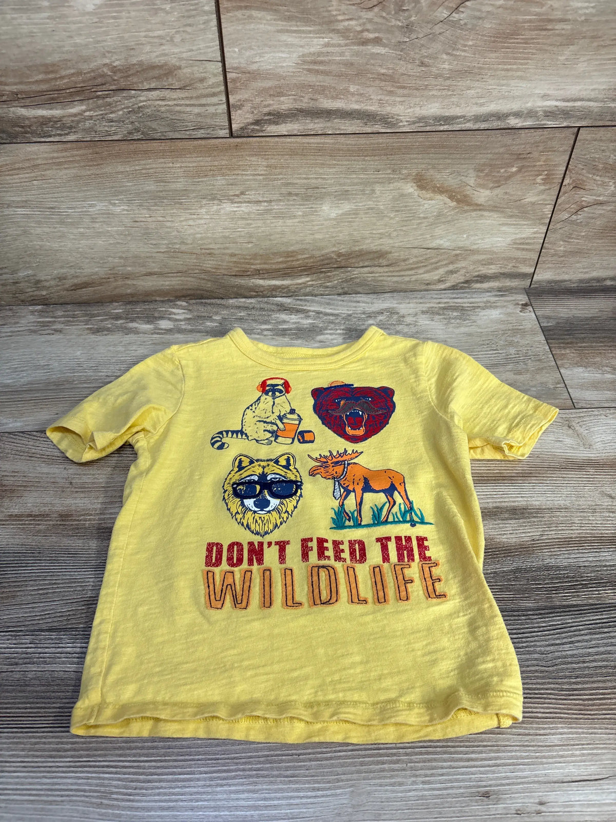 Yellow Baby Gap toddler shirt with 'Don't Feed The Wildlife' graphic and animal illustrations