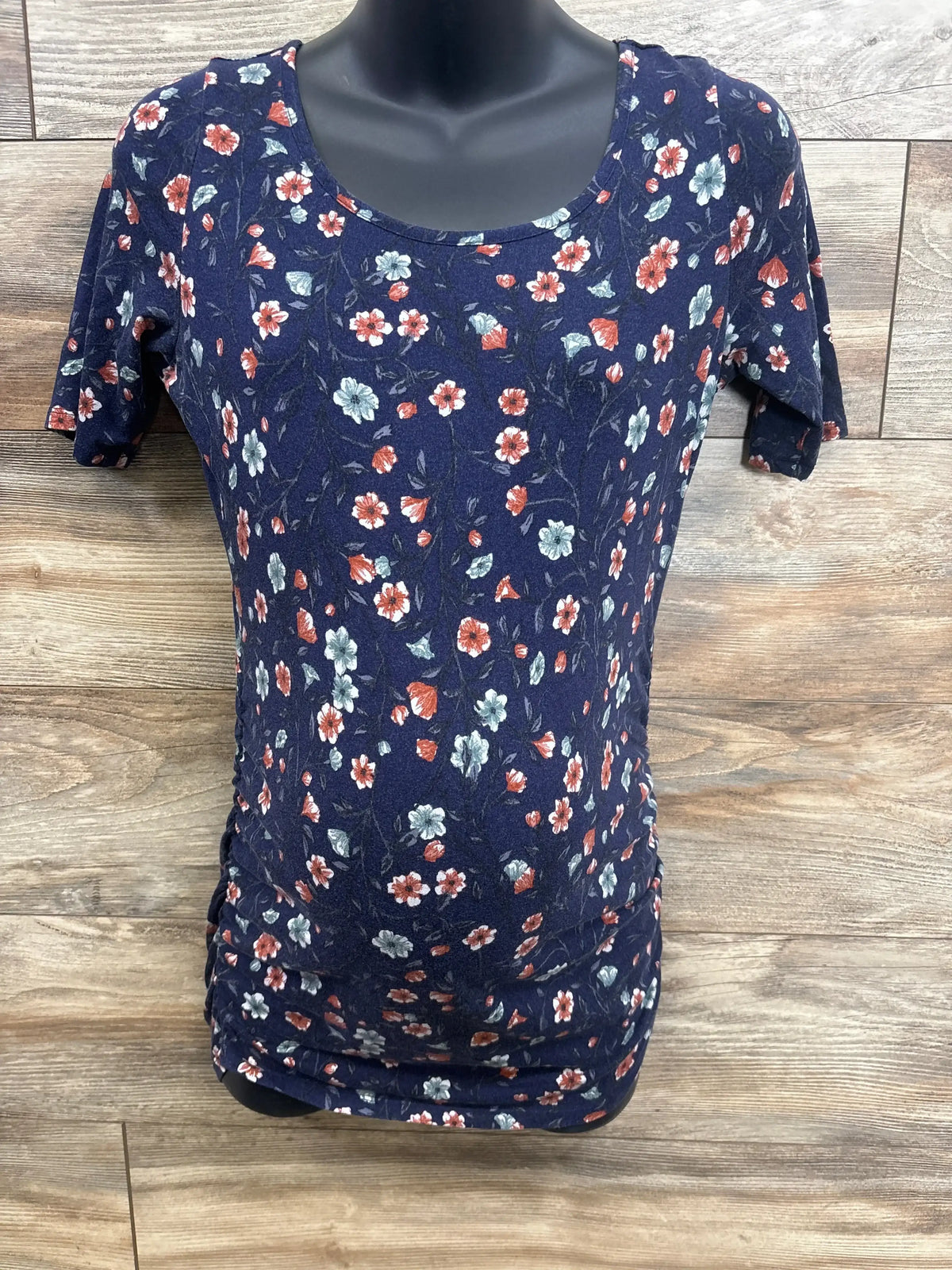 Navy floral maternity top with short sleeves and ruched sides for comfort and style