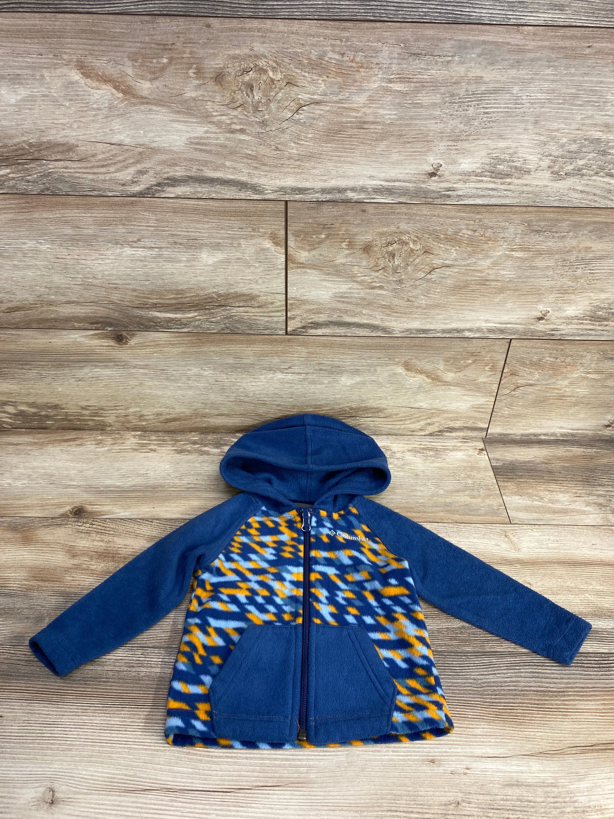 Columbia toddler fleece jacket with blue sleeves, hood, and yellow-blue geometric patterned front and pockets