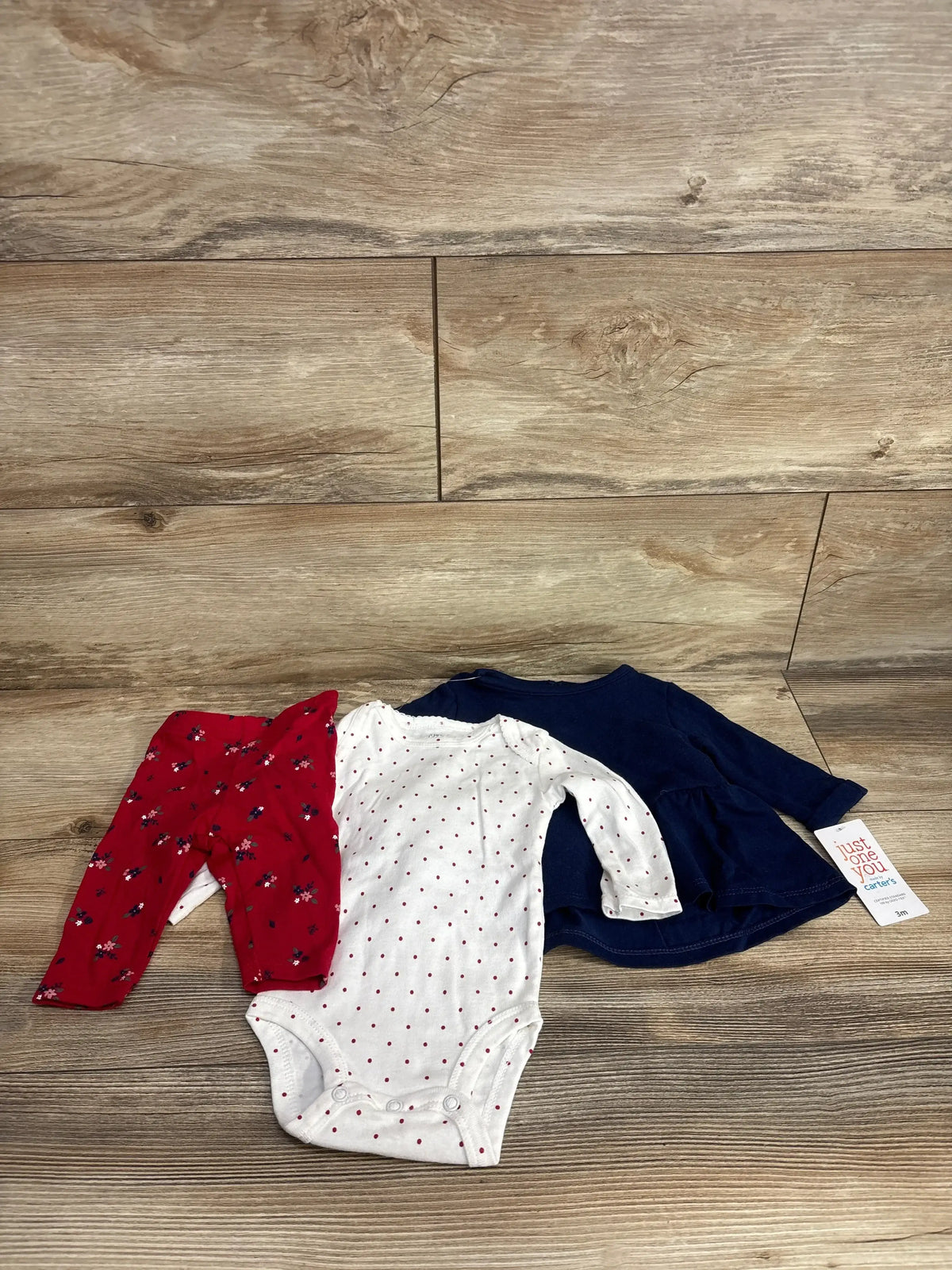 Baby girl outfit set with red floral pants, white polka dot bodysuit, and navy dress, size 3M