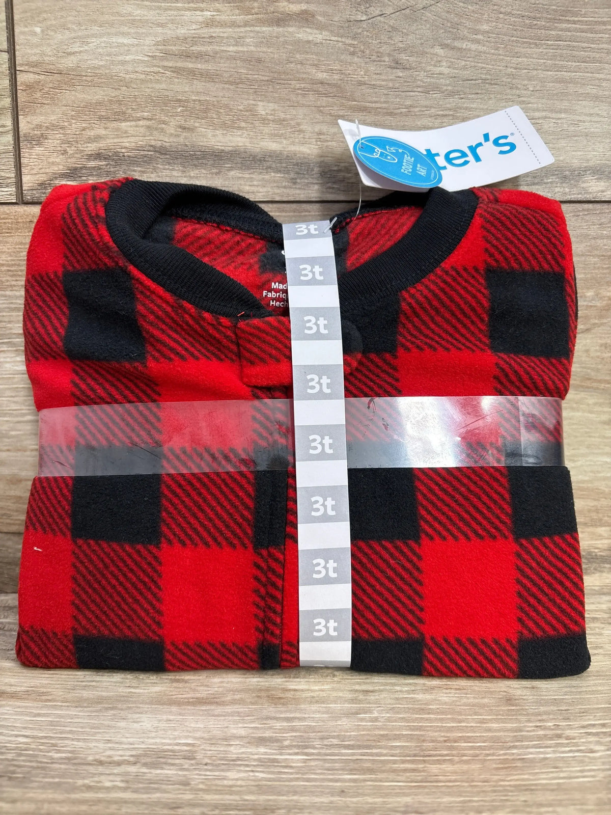 Folded red and black plaid toddler fleece pajama size 3T with black collar, tag attached