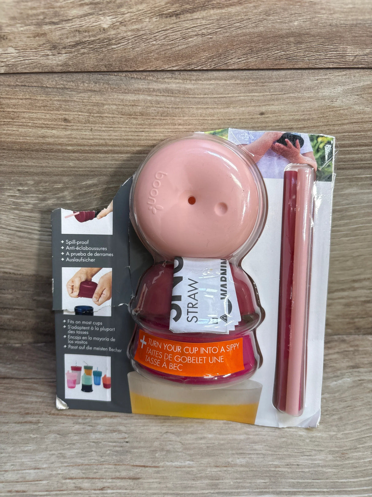 Pink silicone spill-proof cup lid and straw by Boon, fits most cups, converts cups into sippy cups