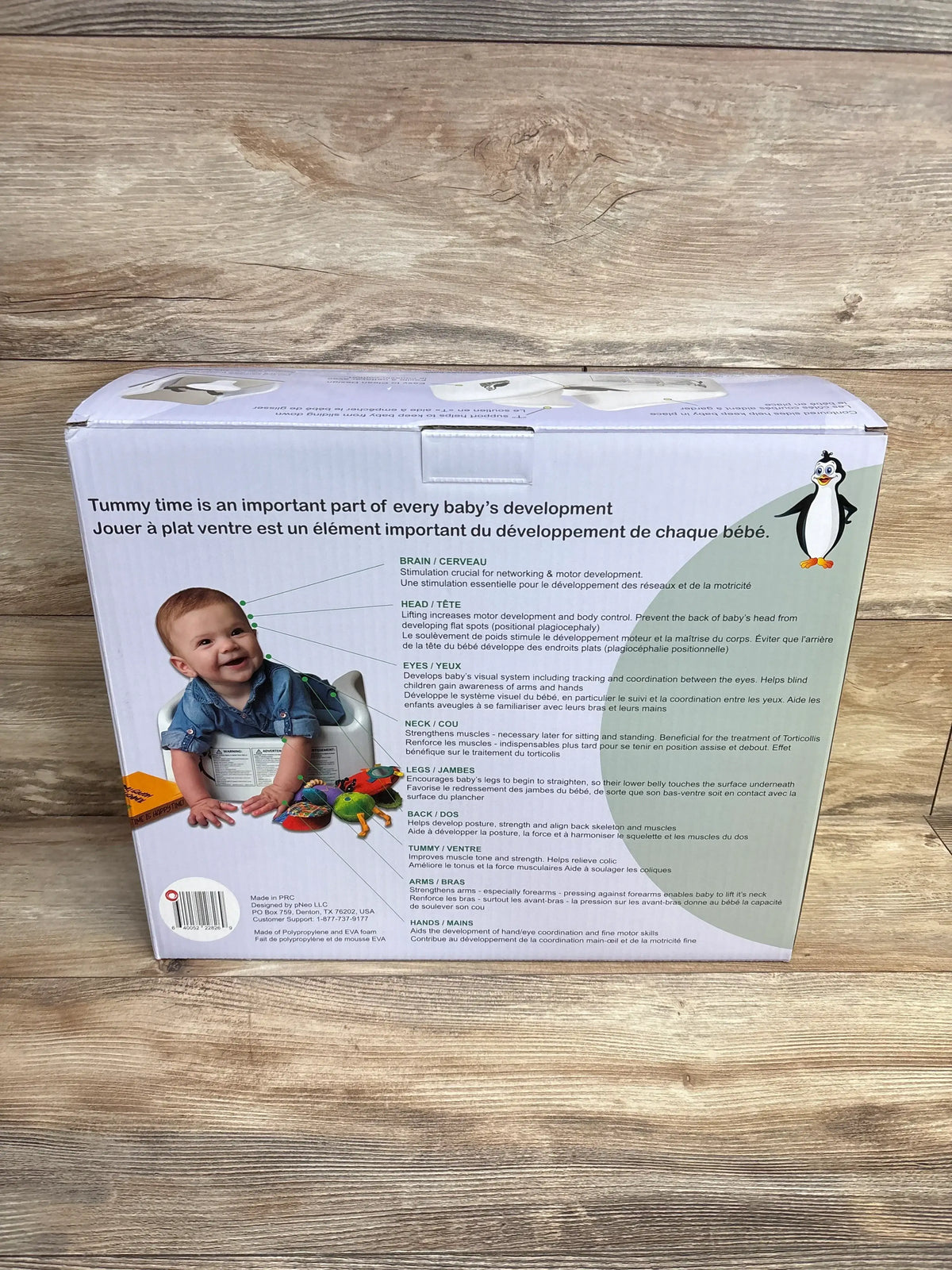 Back of Tumzee Incline Tool box with baby on wedge, headline: Tummy time is an important part of every baby’s development