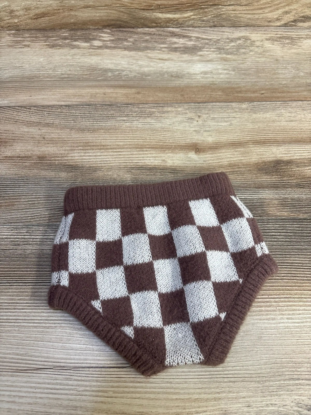 Front view of Rylee + Cru sweater bloomers showing brown and cream checker knit and ribbed waistband on wood background