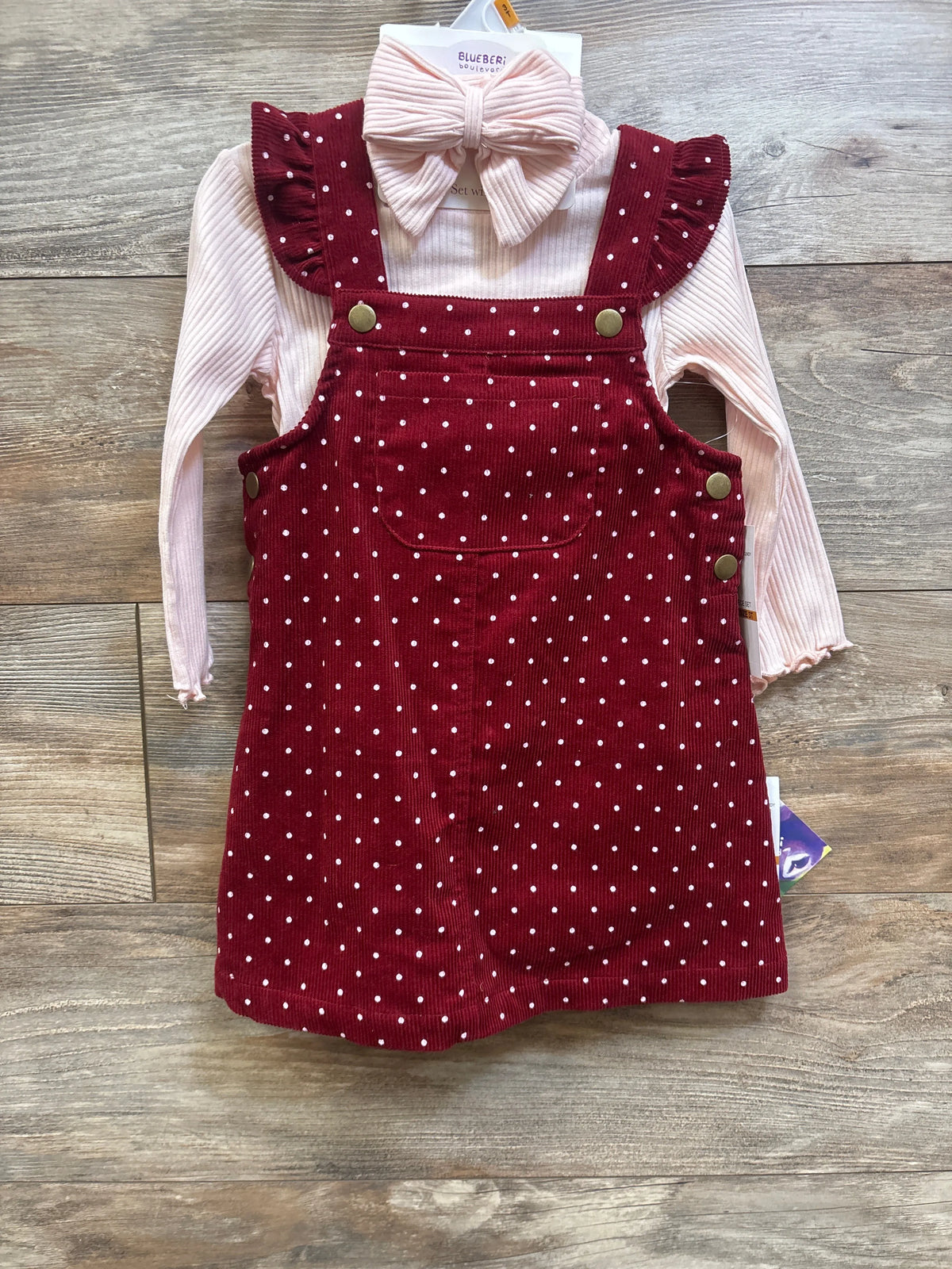 Front view of Blueberi Boulevard 3-piece set with pink long-sleeve shirt and headband, burgundy polka-dot skirtall