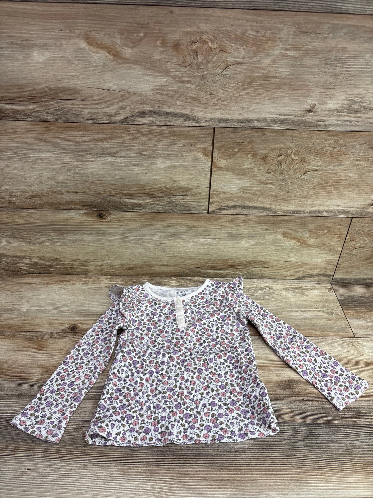Carter's floral waffle knit Henley shirt in white, size 4T, laid flat on a wooden background.