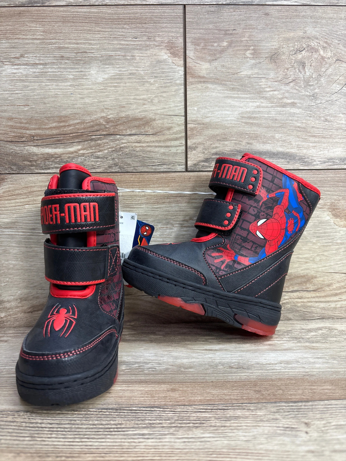 Kids black and red Spider-Man winter boots with Velcro straps and superhero graphics