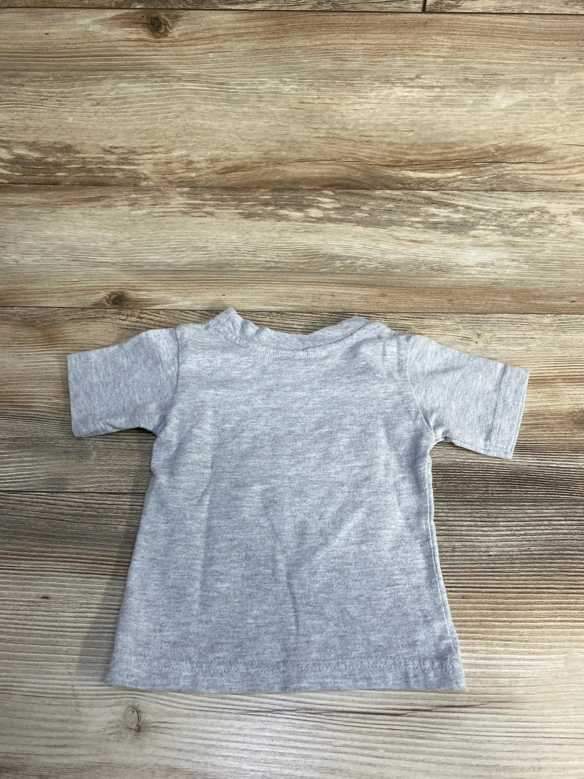 Back view of Kiddy Kat Virginia Cavaliers logo shirt in grey, showing its plain cotton design on a wood floor