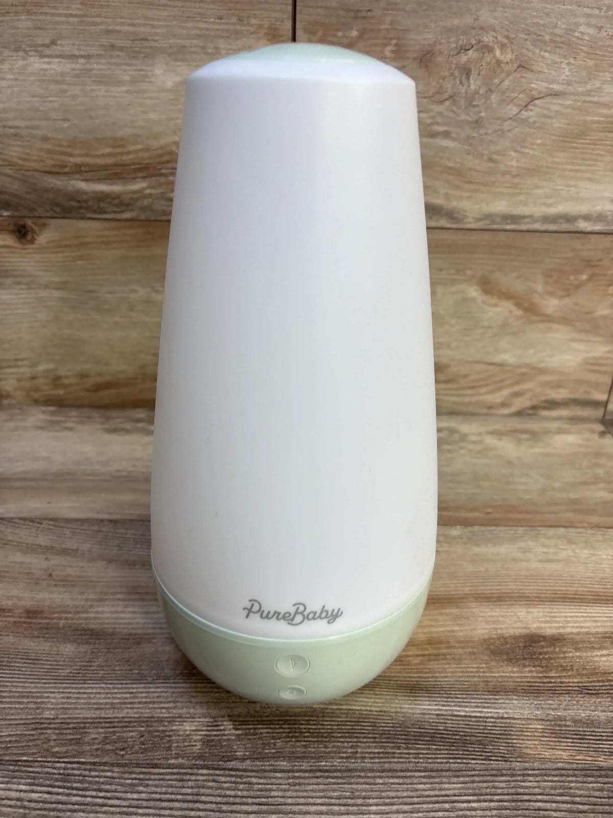PureBaby white and mint humidifier for baby nursery, sleek design on wooden surface