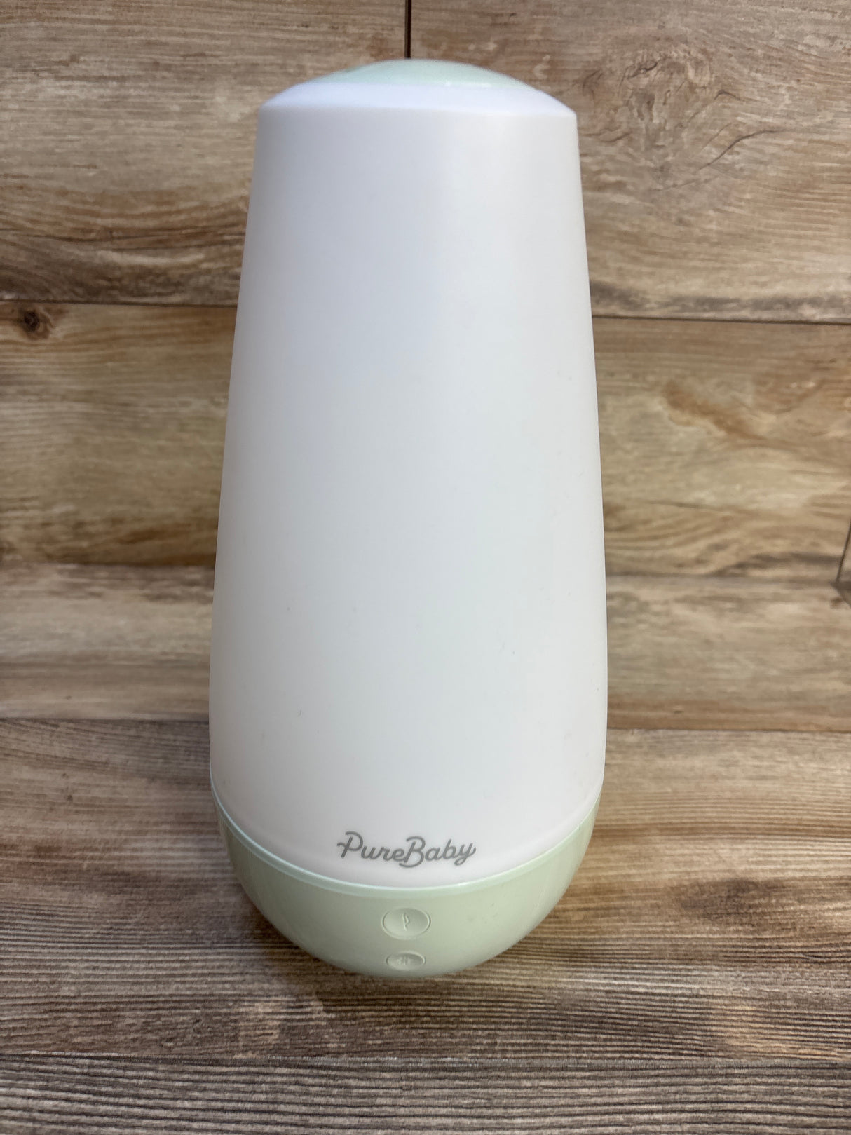 PureBaby white and mint humidifier for baby nursery, sleek design on wooden surface