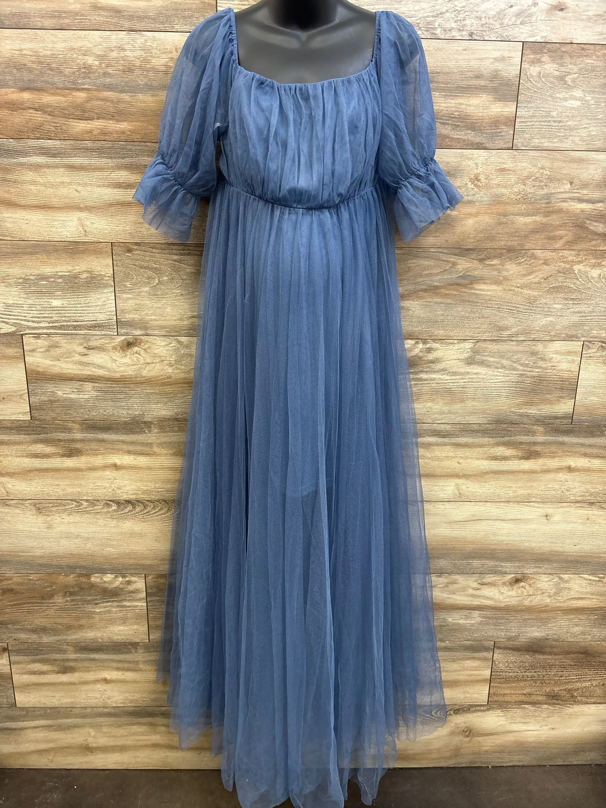 Front view of Ever Pretty maternity off-shoulder tulle maxi dress showcasing ruched bodice, puff sleeves, and floor-length layered skirt with wood panel background