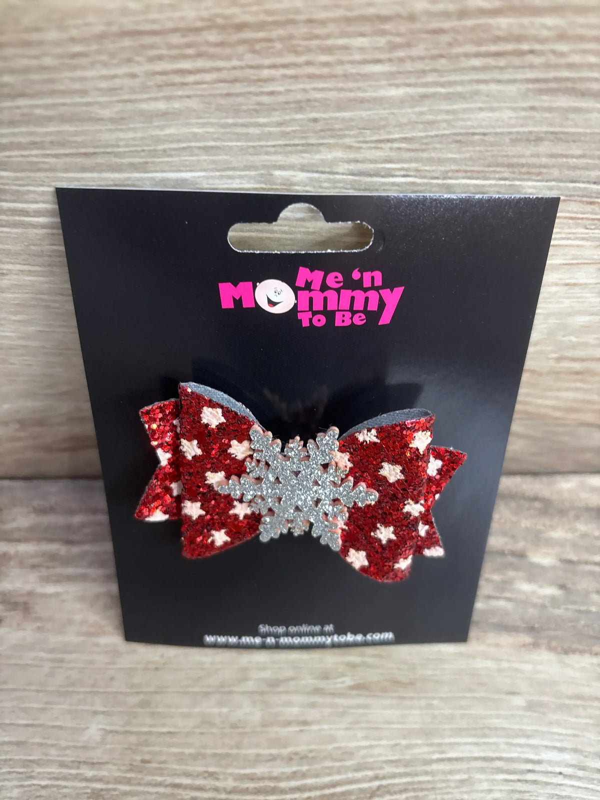 Red glitter bow with silver snowflake, kids holiday hair accessory on black card