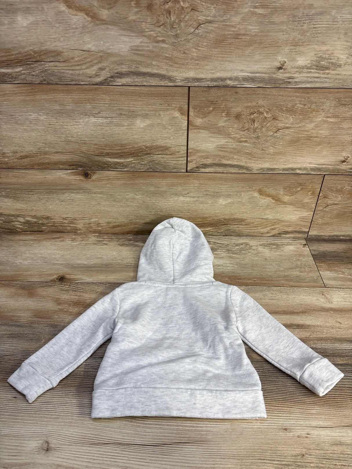 Gray toddler hoodie on wood floor, back view, soft fleece sweatshirt