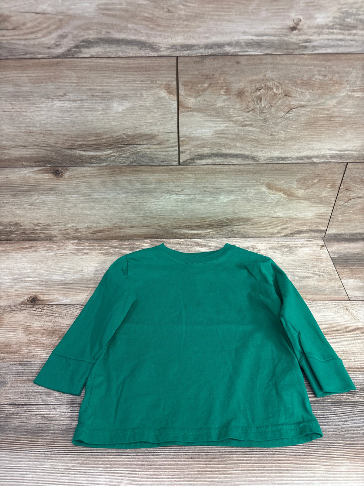 Rabbit Skins green long sleeve toddler shirt size 3T on a wooden background