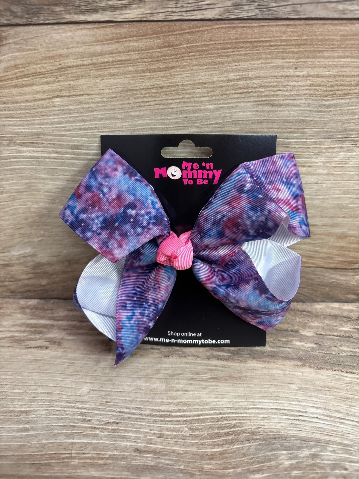 Front view of large galaxy purple hair bow showing layered bow shape and alligator clip on white background