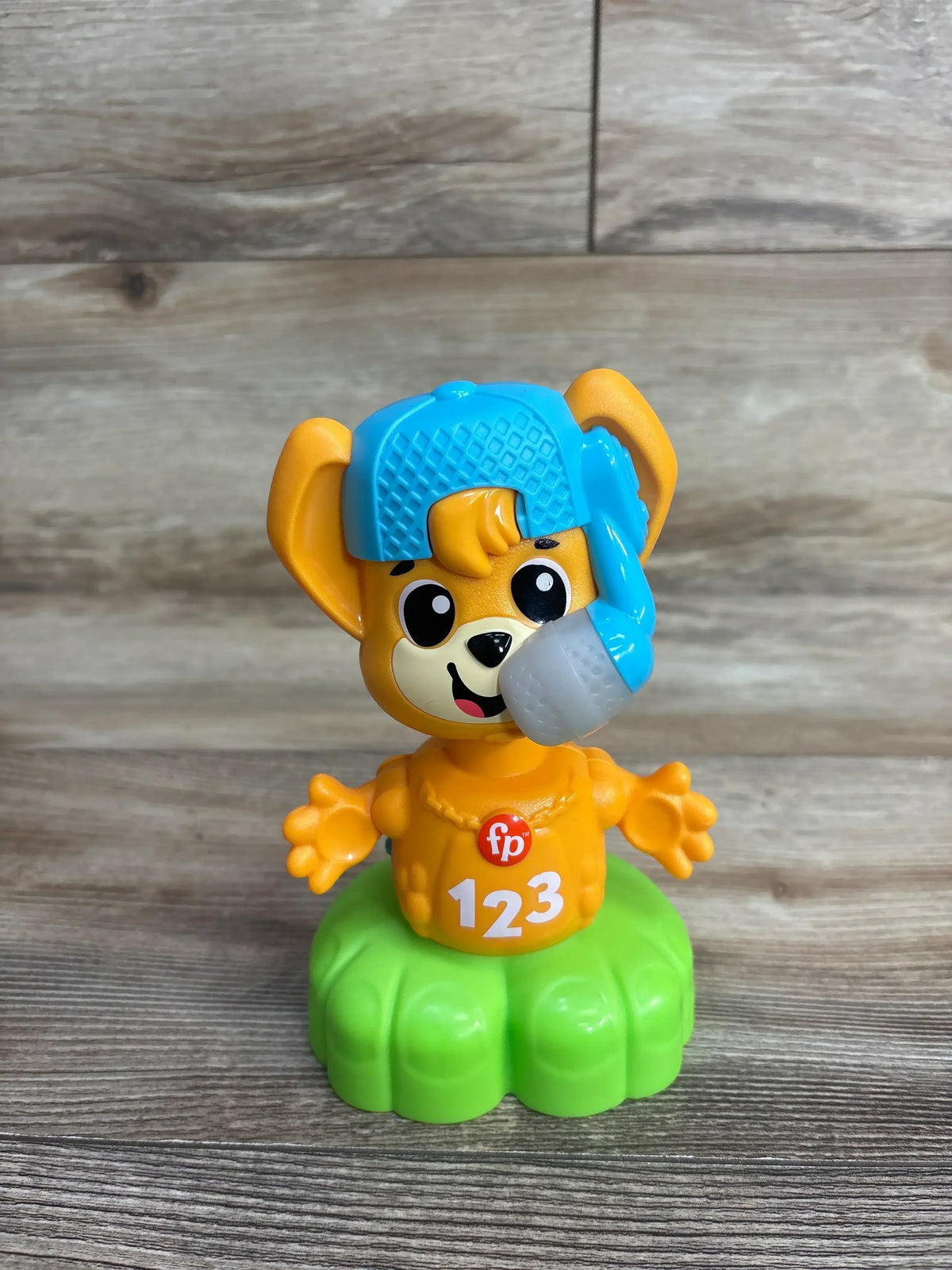 Front of Fisher-Price Link Squad Opposites Fox showing orange fox with blue helmet and headset, 123 on chest on green base