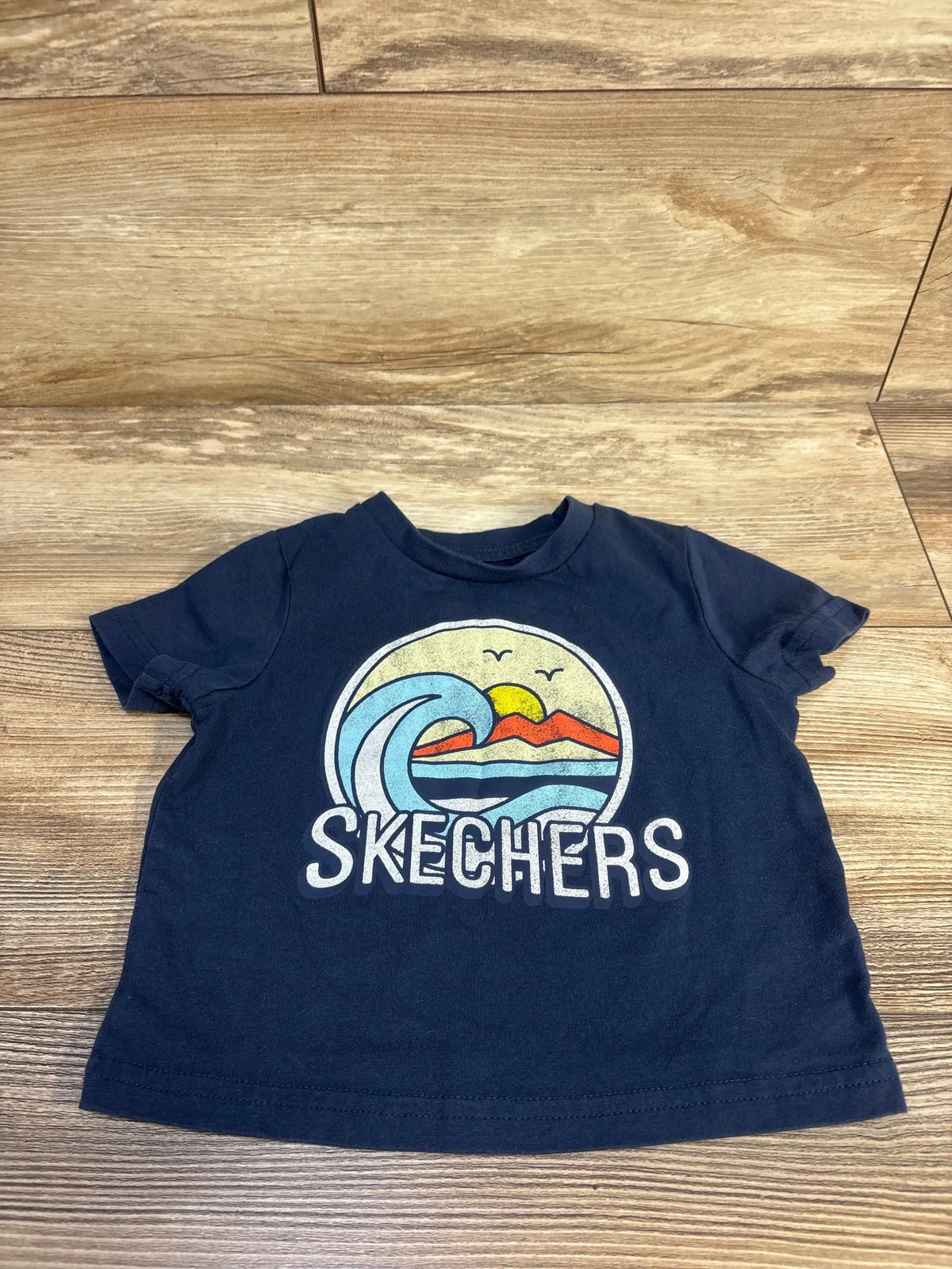Navy blue kids Skechers t-shirt with ocean wave graphic, ideal for toddler boys' casual wear