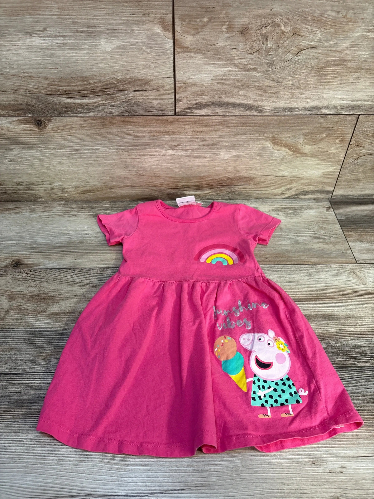 Pink toddler dress with cartoon pig, rainbow, ice cream, and 'sunshine vibes' text