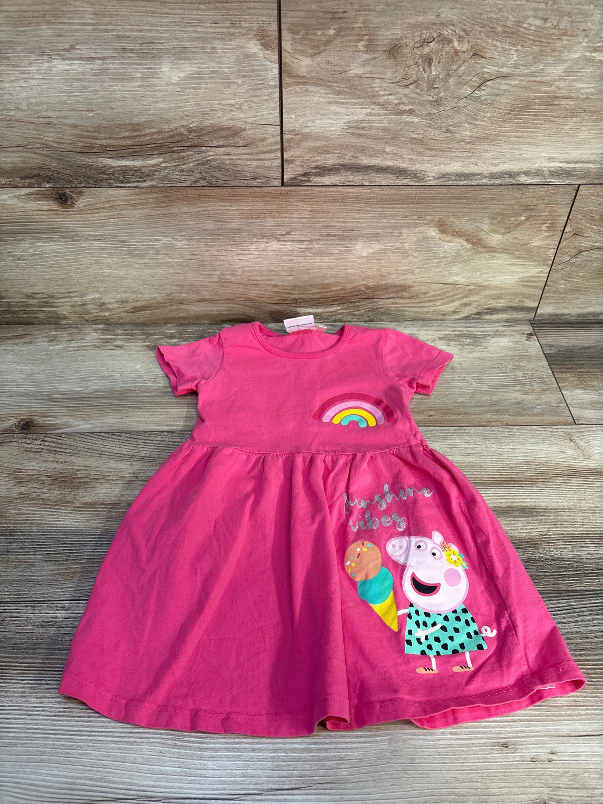 Pink toddler dress with cartoon pig, rainbow, ice cream, and 'sunshine vibes' text