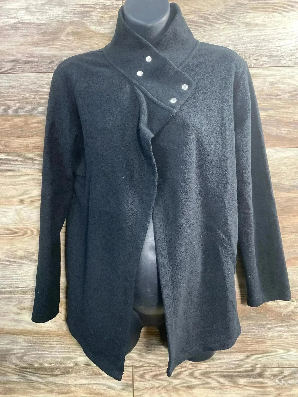 Front view of Gap maternity snap nursing sweatshirt showcasing crossed snap collar and open front on wooden background