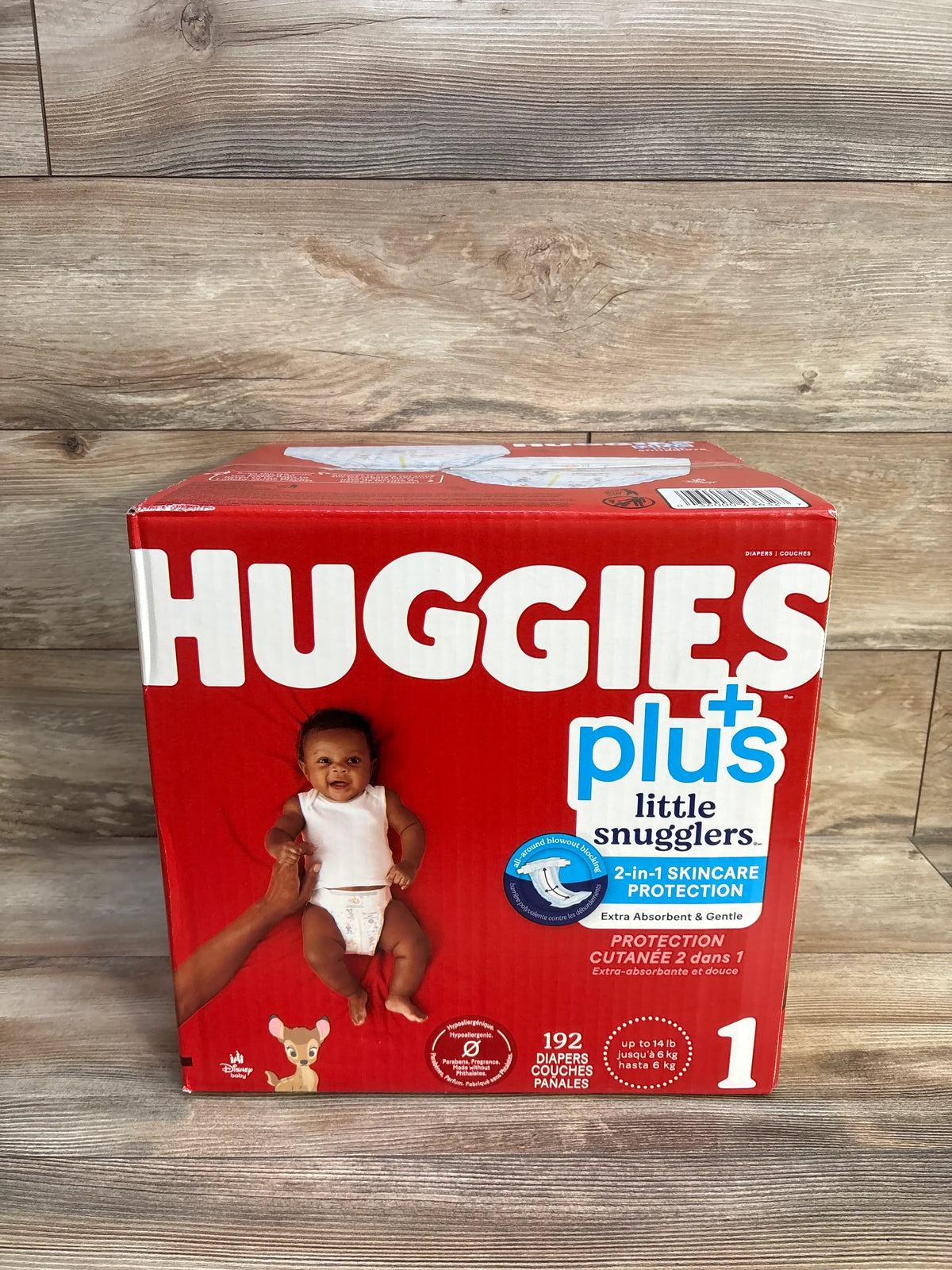 Front view of Huggies Plus Little Snugglers diapers box showcasing 192 diapers, size 1, and 2-in-1 skincare protection