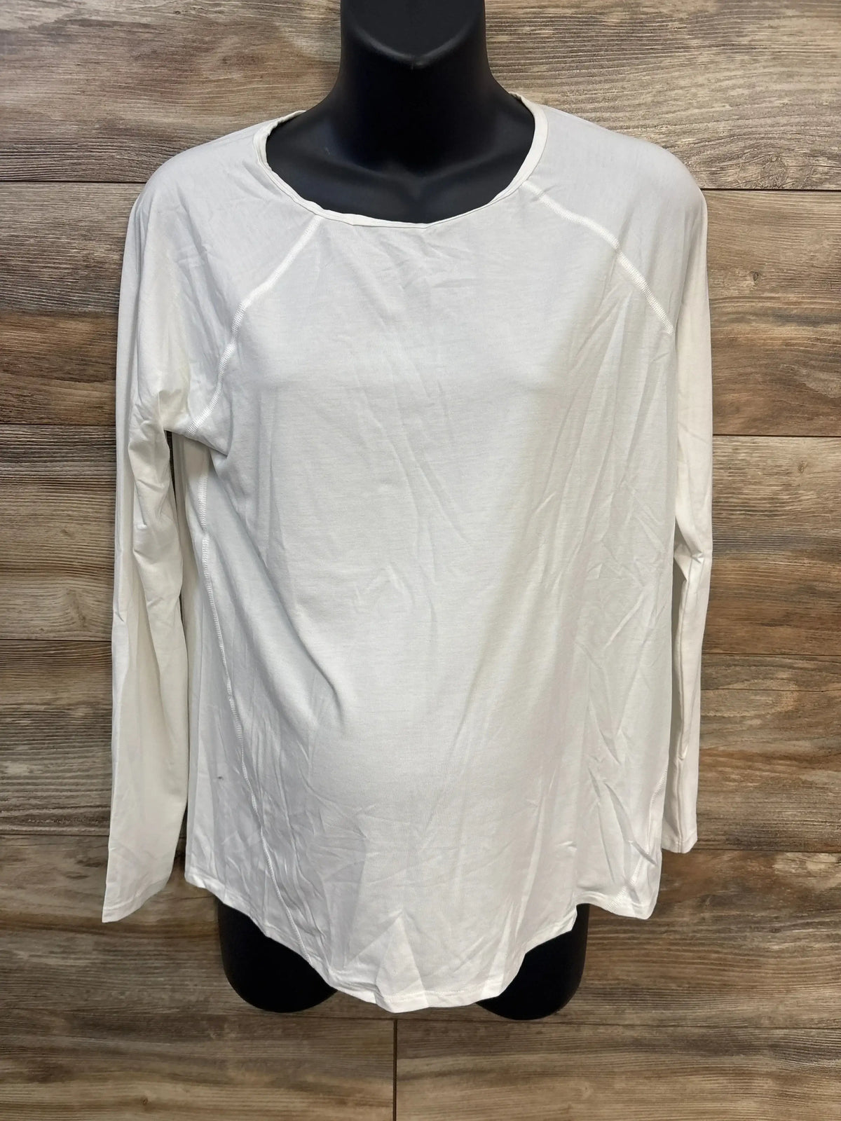 Front view of Gap Maternity Breathe white long-sleeve shirt with crew neck and maternity fit on black mannequin