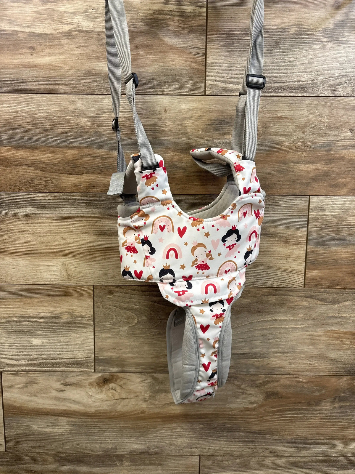 Front view of Watolt baby walking harness with princess print, padded leg openings and adjustable grey straps