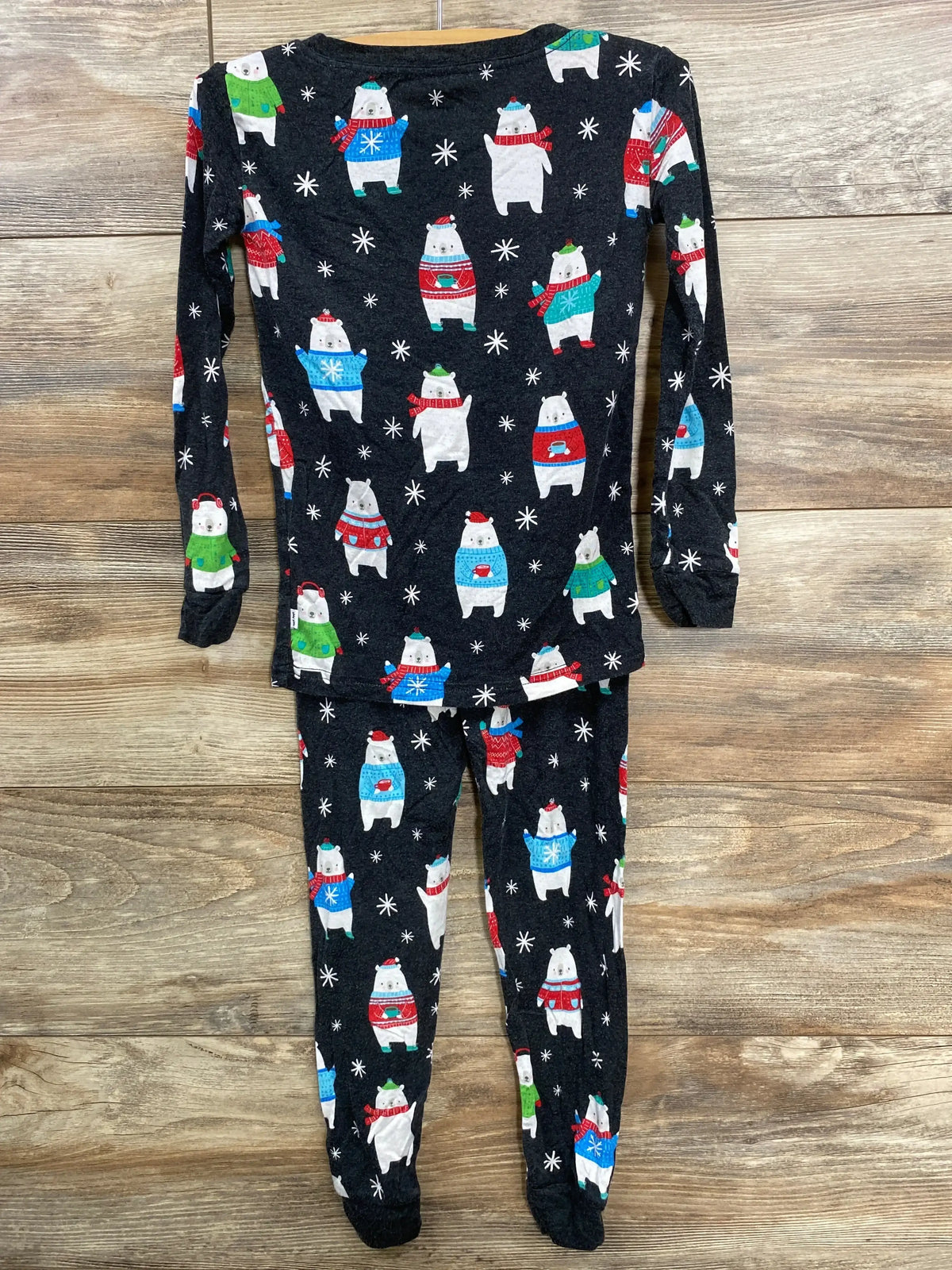 Kids' holiday pajama set with polar bears in sweaters and snowflakes on dark fabric
