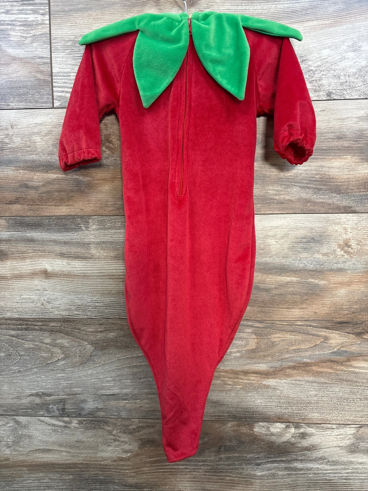 Red chili pepper baby costume with green leaf collar, perfect for Halloween or themed events.