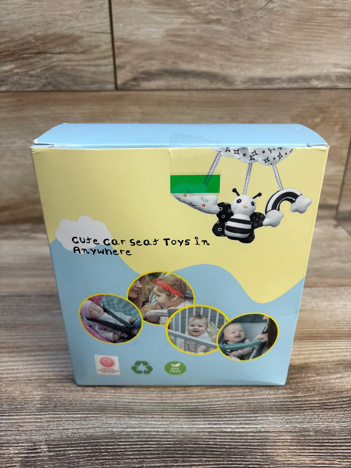 Cute car seat toy with bee, rainbow, and cloud for babies, BPA-free and recyclable packaging